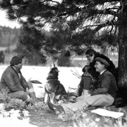 Frank Lloyd relaxes on set with husky Winds of Chance - Frank Lloyd relaxes on set with husky